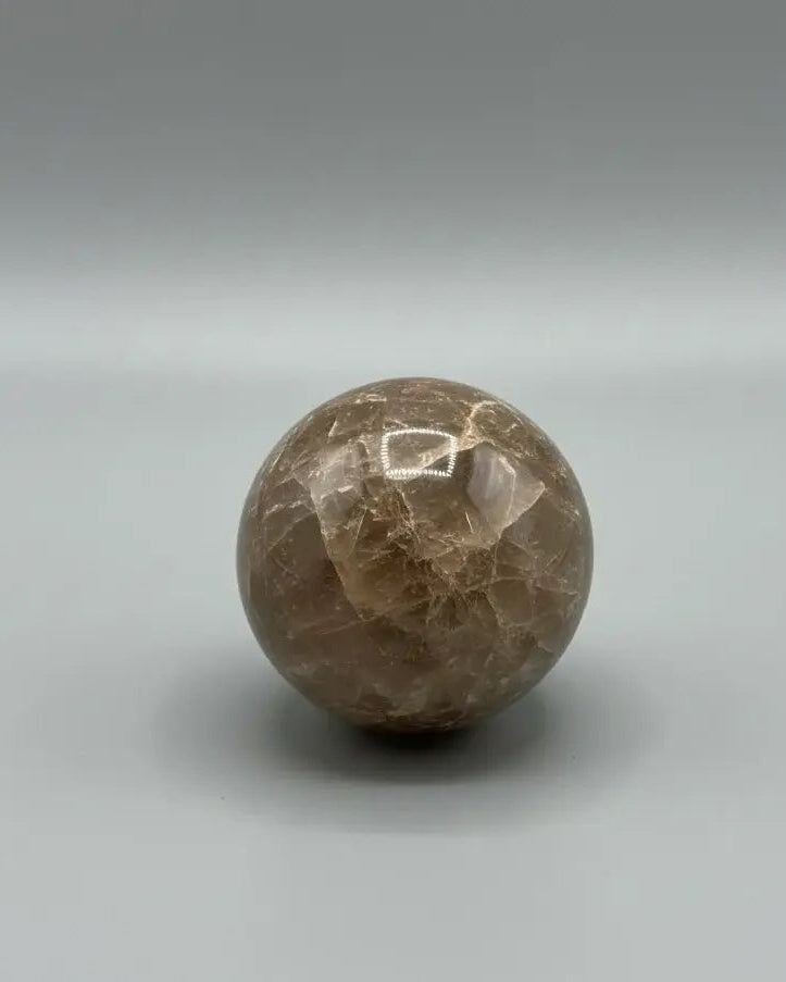Esfera de piedra sol negra