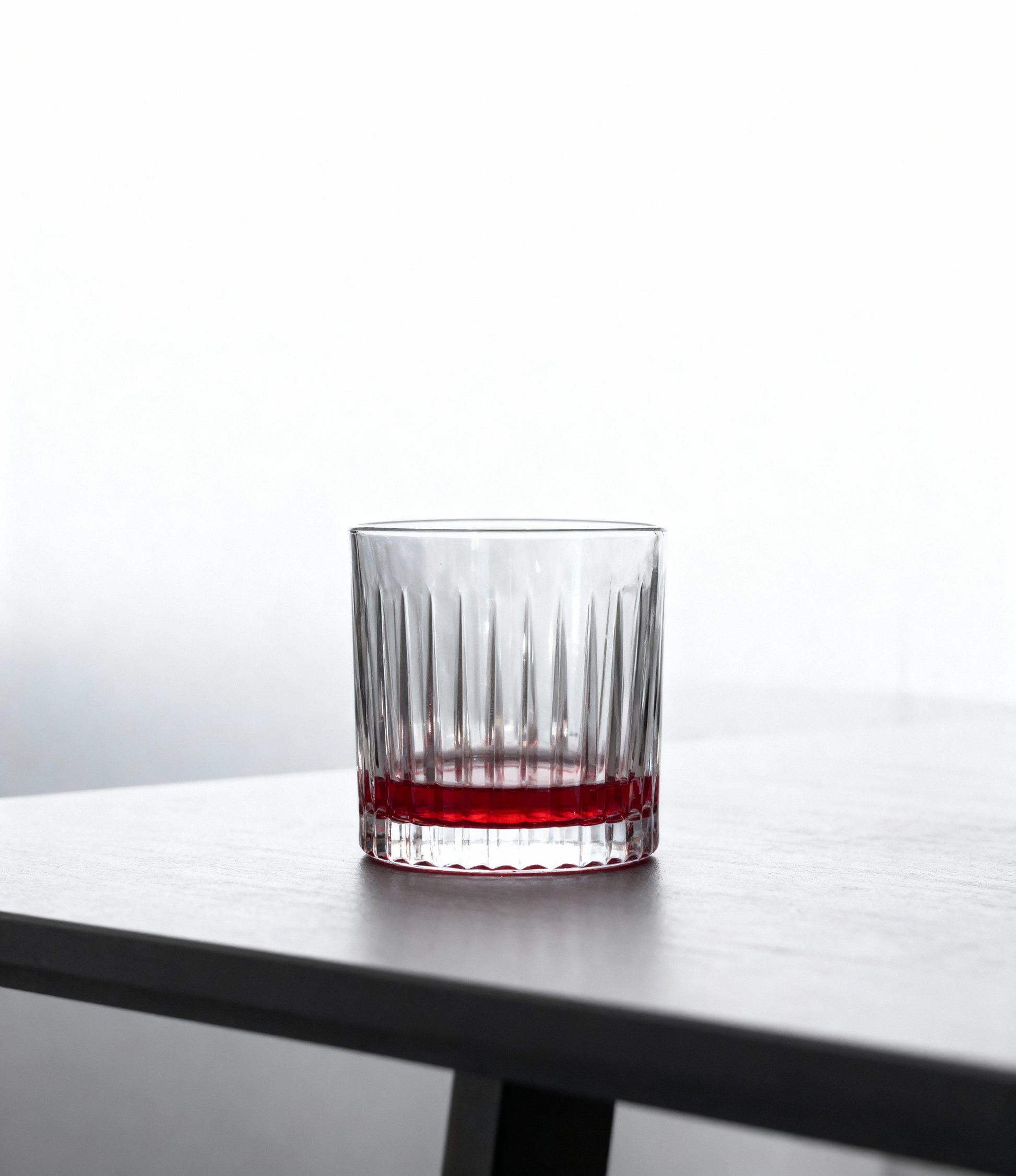 Vaso de whisky con culo rojo