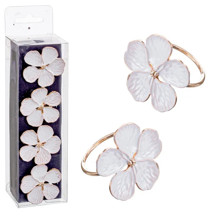 Servilleteros con diseños de flores blancas y árboles